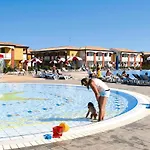 Apartment In Villaggio Ai Pini In Lido Altanea